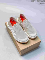 Pair of light gray Adidas TERREX slip-on sneakers displayed on a TERREX shoe box, with the code 2607JJD296A26 and size range 36–45 visible at the top.