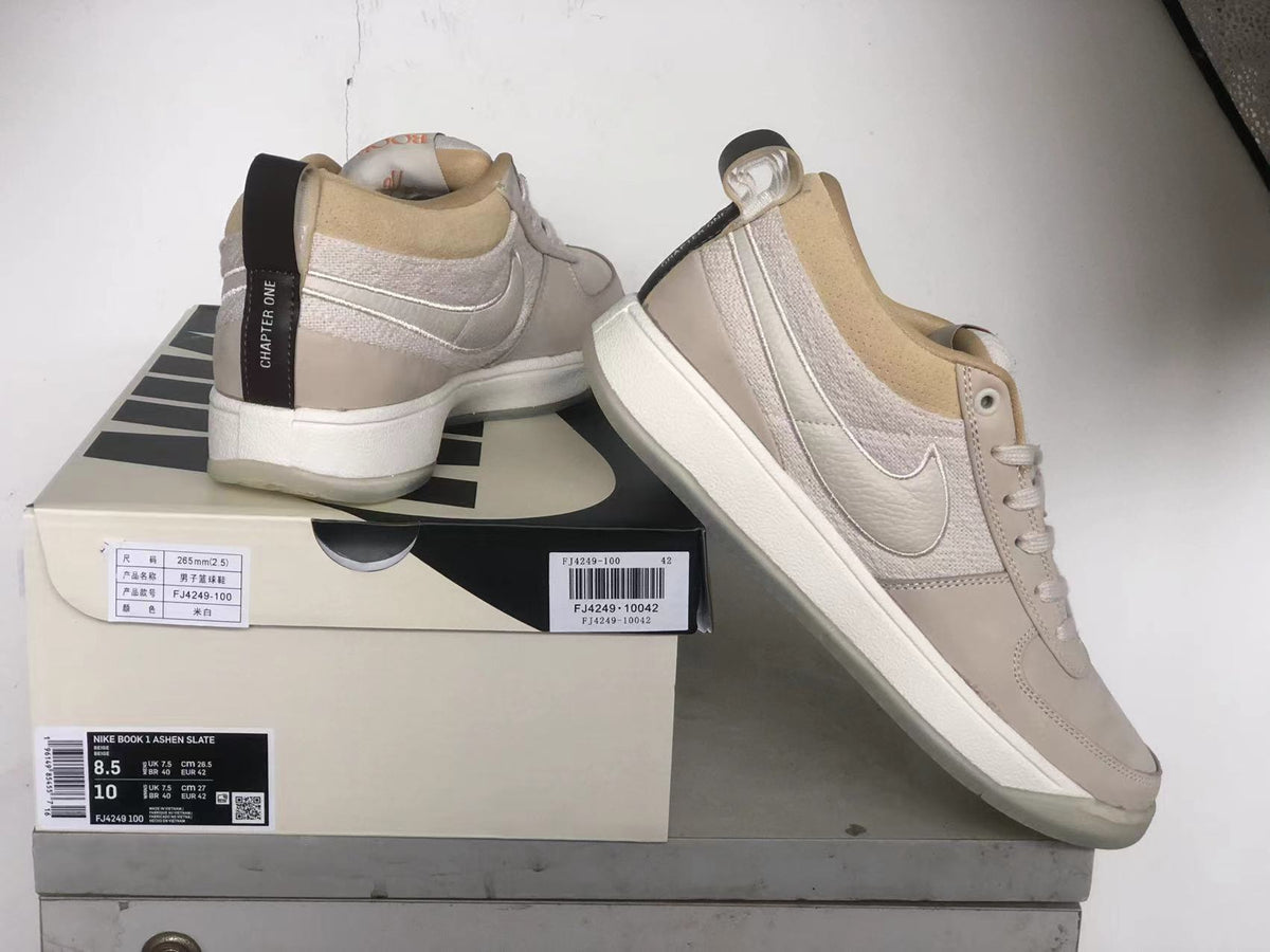Nike Book 1 Ashen Slate shoes beside a labeled box; the label shows model and size information.