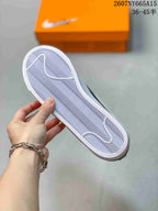 Close view of the sneaker outsole showing a white herringbone-style tread pattern.