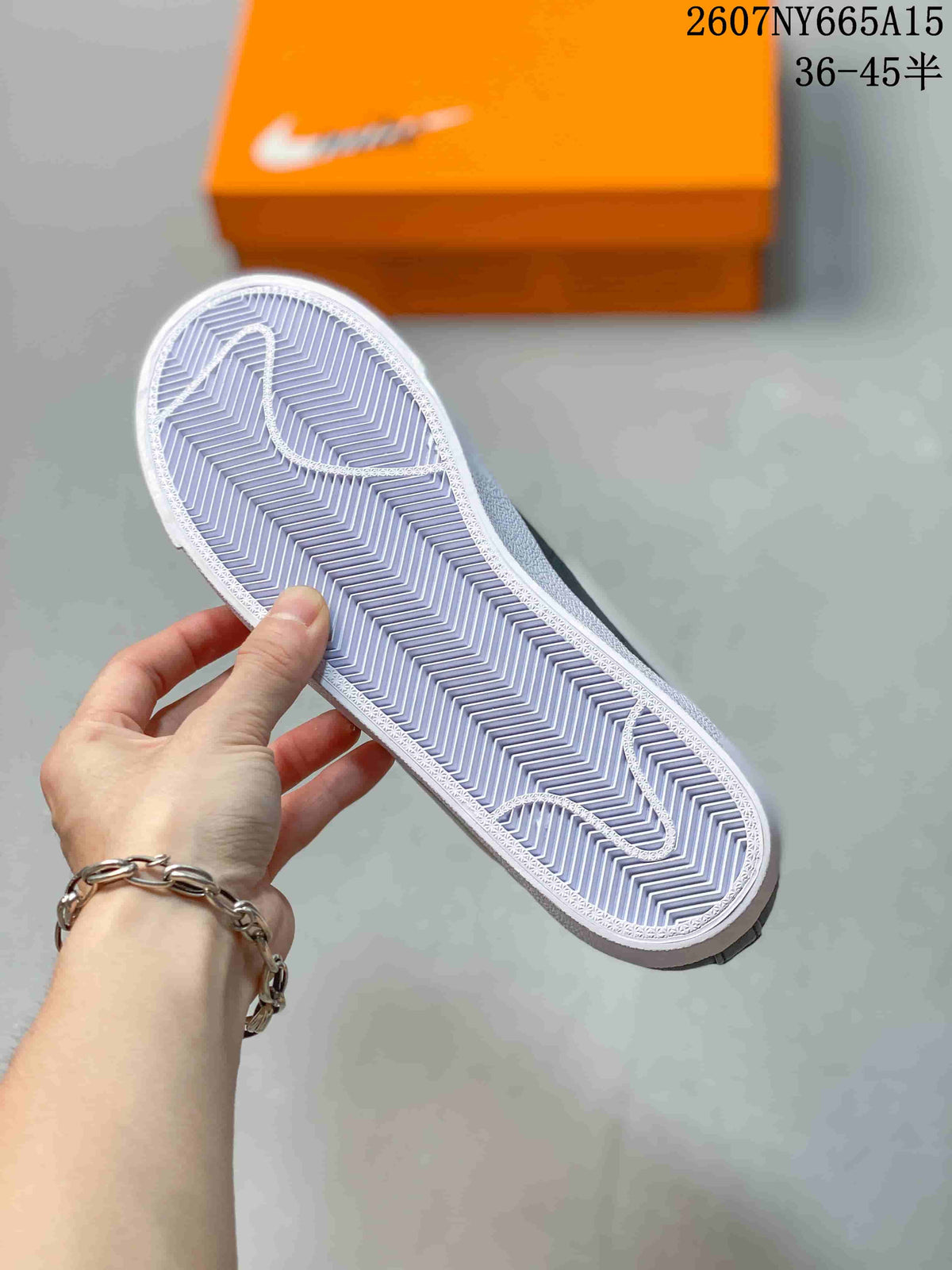 Close view of the sneaker outsole showing a white herringbone-style tread pattern.
