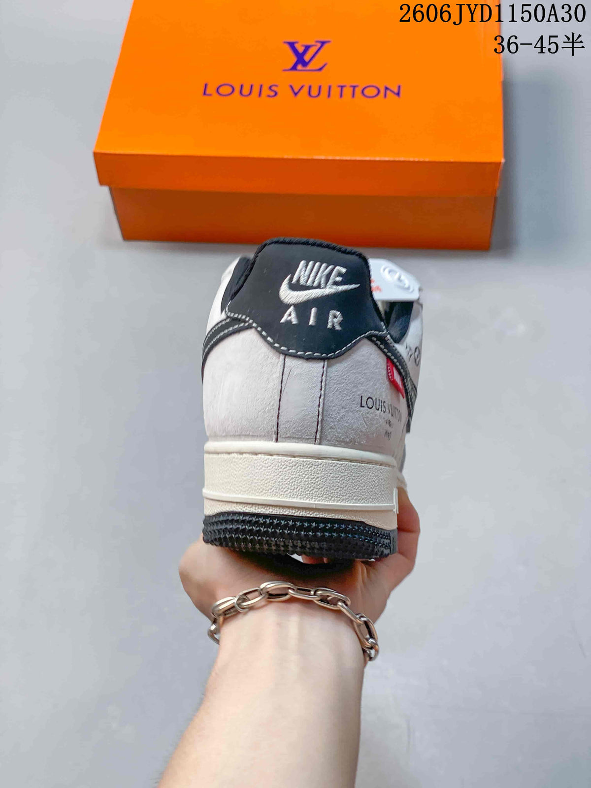 Rear view of a low-top sneaker with a dark heel panel and contrasting stitching