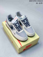 Pair of grey, white and navy Nike Air Force 1 sneakers displayed on a Nike shoebox, with style code 2607JYD1155A15 and size range 36–45.5 shown in the image.