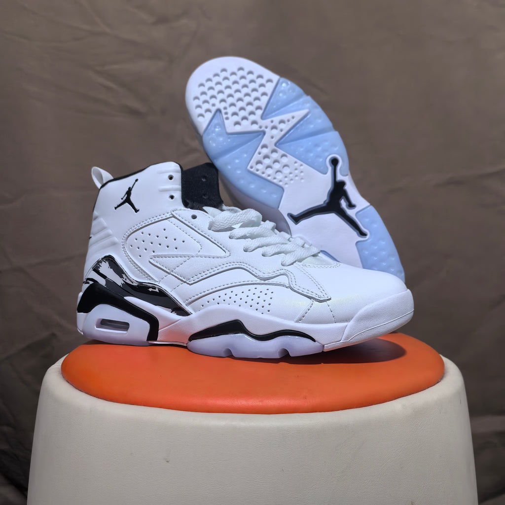 White and black high-top sneaker with its outsole visible, showing patterned tread and a Jumpman logo.