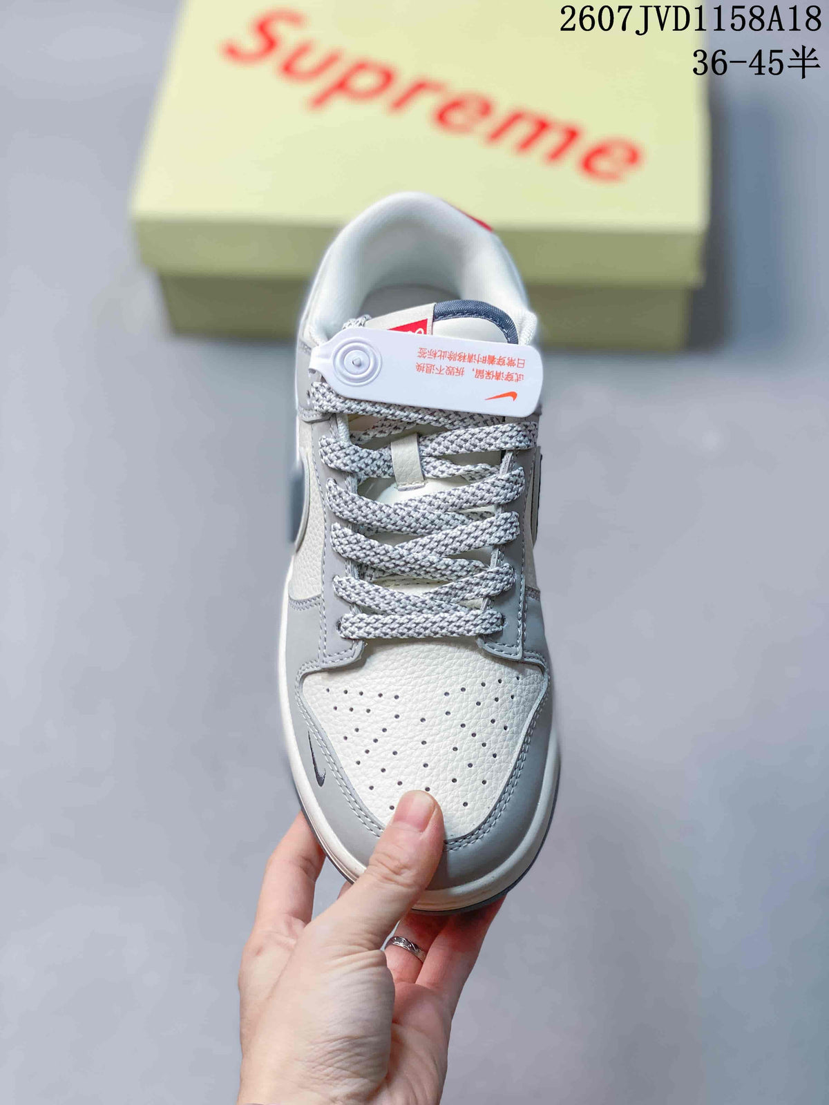 Top view showing the perforated light toe box, gray laces, tongue detail, and padded collar.