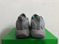 Rear view of grey Nike KD 4 basketball shoes with green accents