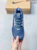Top view of the blue lace-up sneaker showing the textured blue upper, tongue labeling, and contrasting side panels.