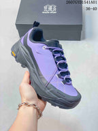 Close-up of the purple sneaker showing its side profile and lacing