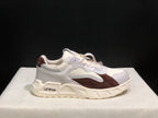 Side view of one white and brown sneaker with visible OFF-WHITE branding on the sole area and heel.