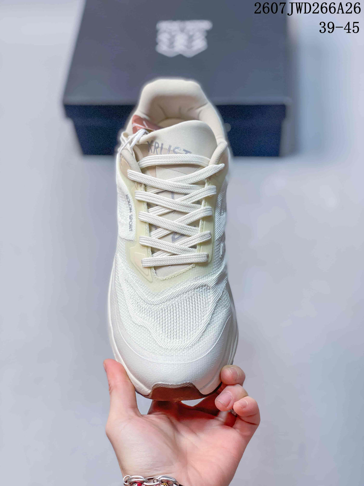 Top view of the cream and white lace-up shoe showing the mesh-like woven toe area and KRUST tongue branding.