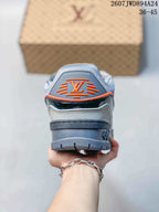 Rear view showing the layered heel, gray outsole, and orange-accented Louis Vuitton logo detail.