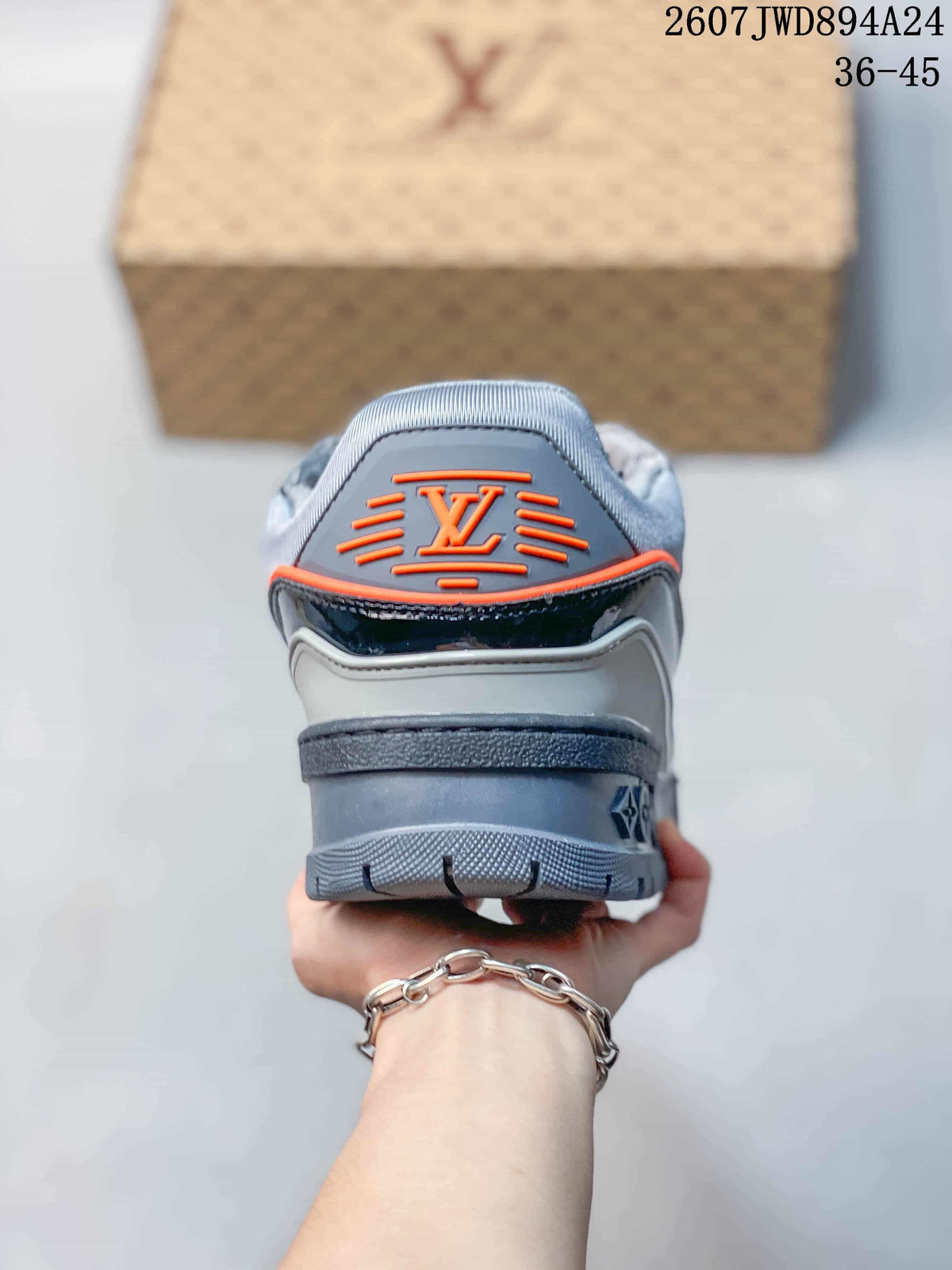 Rear view showing the layered heel, gray outsole, and orange-accented Louis Vuitton logo detail.