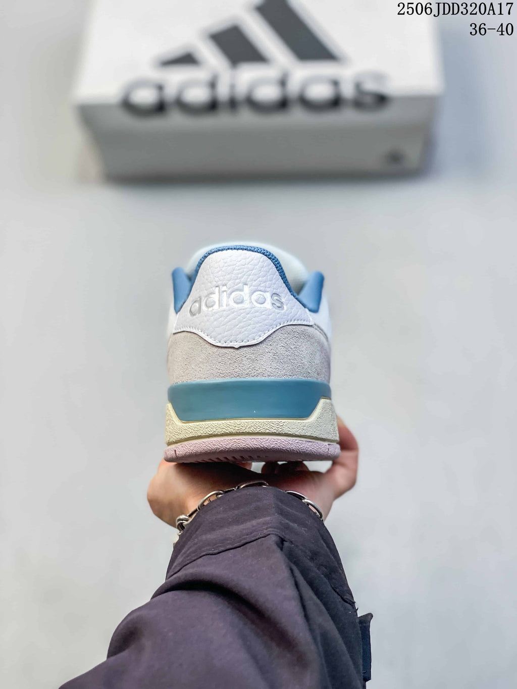 Rear view of the sneaker showing the adidas heel mark, blue heel accent and layered sole.
