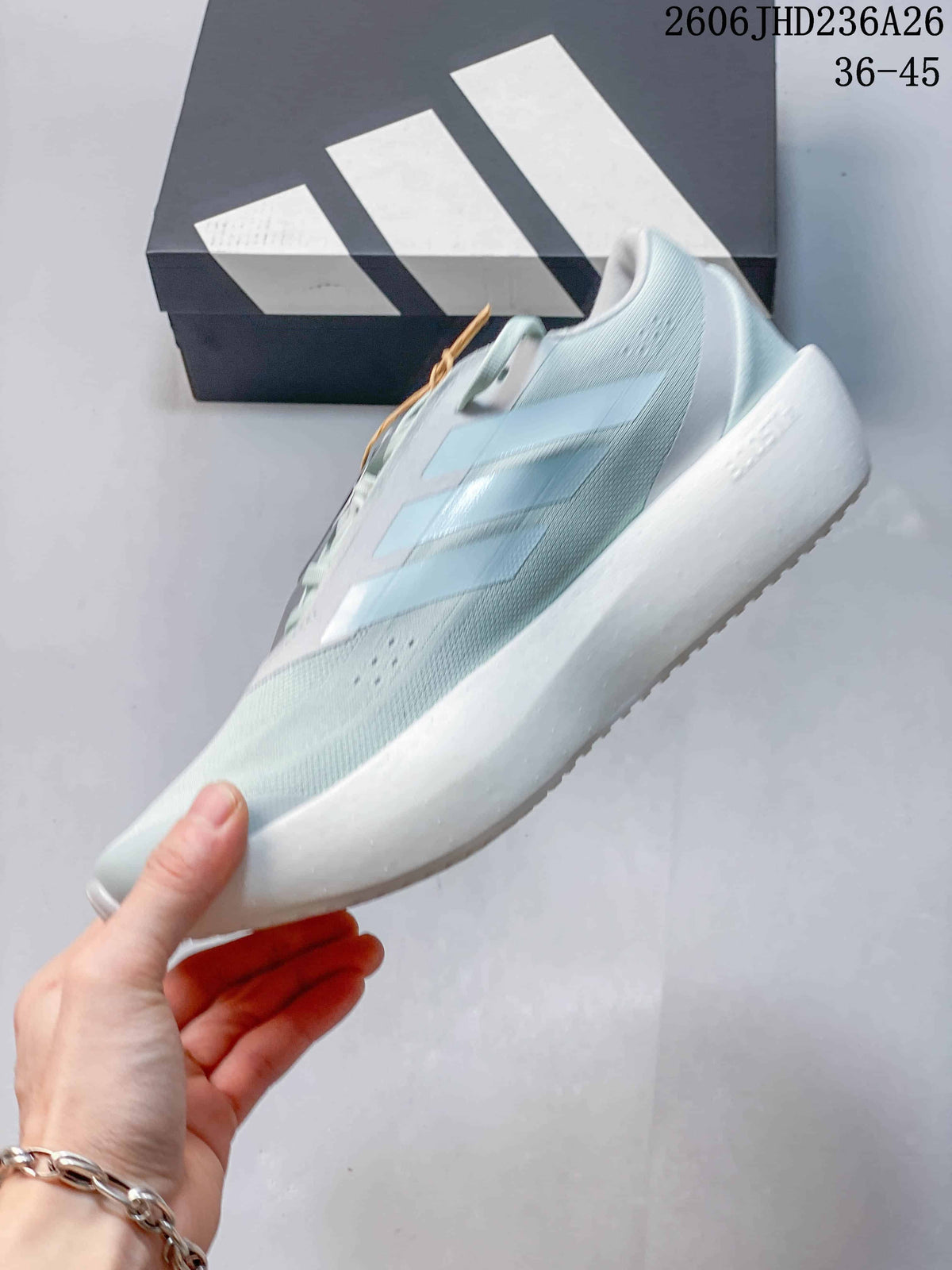 Side view of the pale blue low-top shoe with three side stripes and a thick white sole.