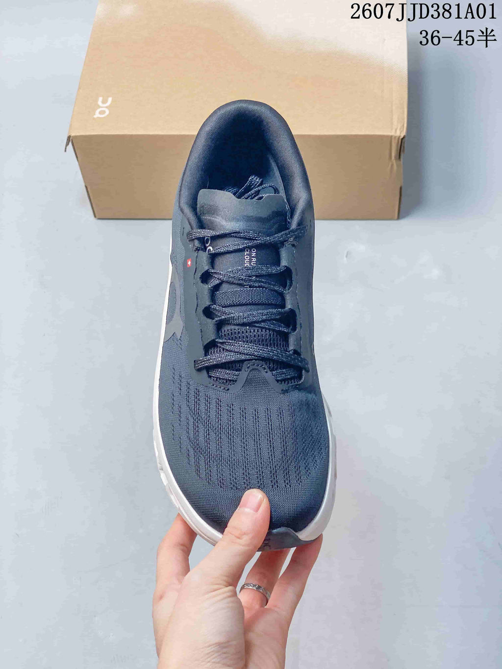 Top view of the shoe showing its laces, tongue and dark navy upper.