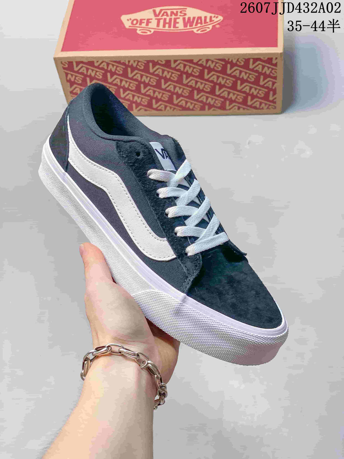 Dark navy Vans Vero LS low-top sneaker with white laces and side stripe.