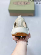 Rear view of the sandal showing the open heel area, heel strap, and layered outsole.