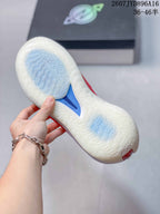 Close view of the translucent outsole showing its repeating traction pattern and blue central section.