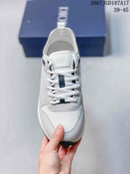 Front view showing the white laces, contrasting dark lace details, tongue branding, and textured toe panel.