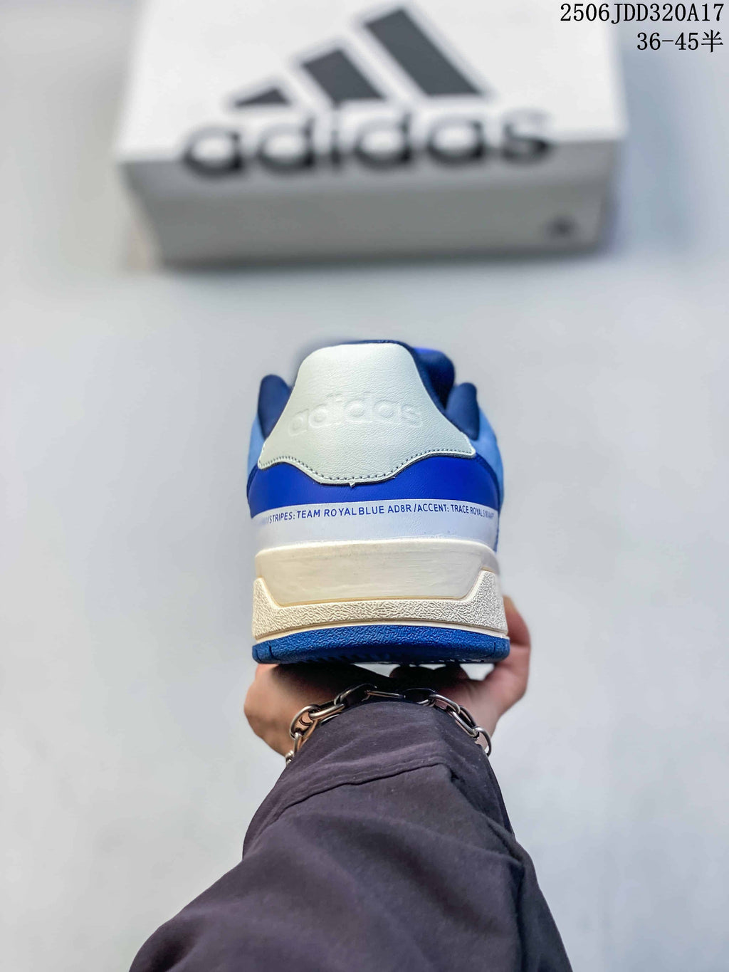 Rear view of the white and royal blue adidas Entrap sneaker showing the heel branding and layered sole.