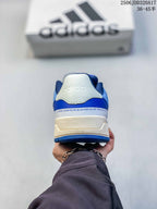 Rear view of the white and royal blue adidas Entrap sneaker showing the heel branding and layered sole.
