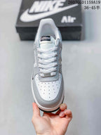 Top view showing the perforated toe box, white laces, tongue label, and layered panels.