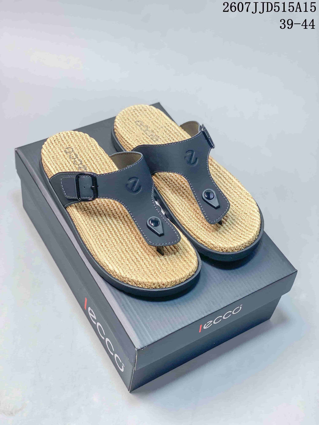 Pair of black ECCO toe-post sandals with textured woven-look footbeds and dark adjustable buckle straps.