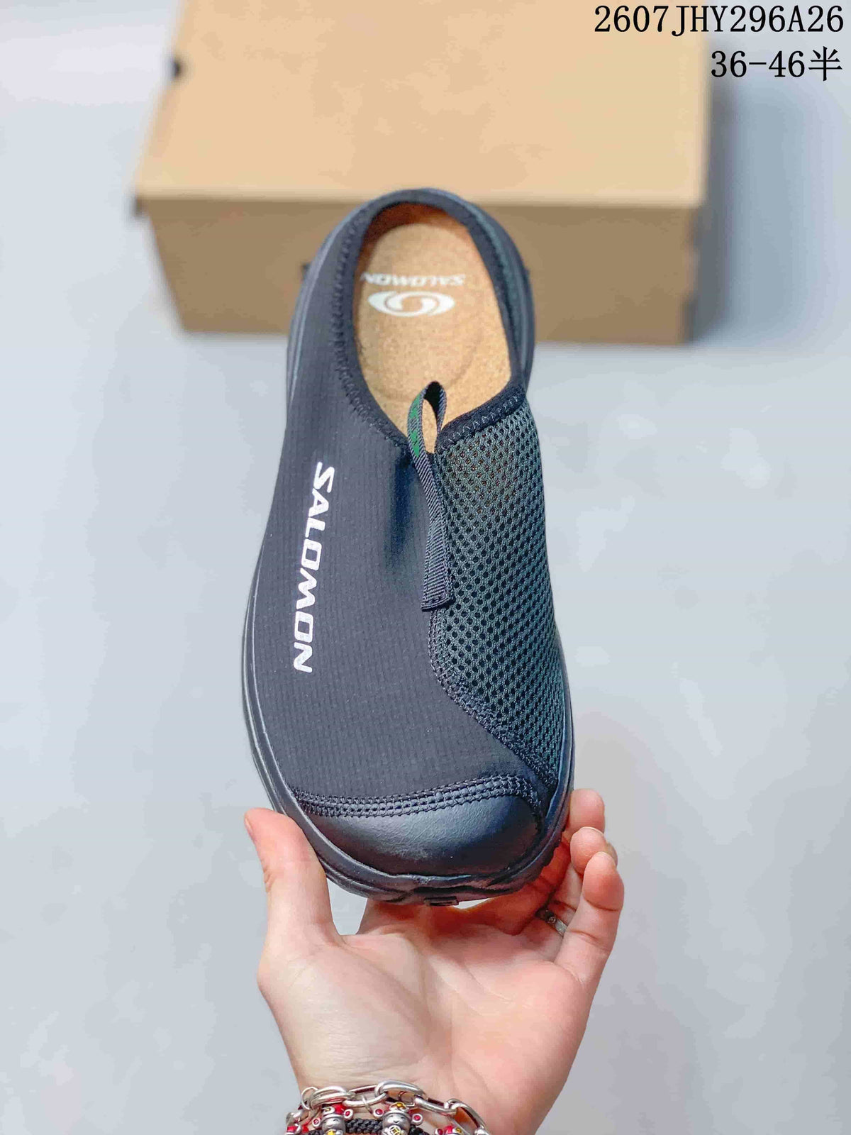 Top view of the black closed-toe slide with mesh panel, pull tab, and Salomon branding.