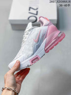 Side view of the white and pink sneaker showing the Swoosh, Air Max 270 branding, perforated-looking upper, and heel unit.