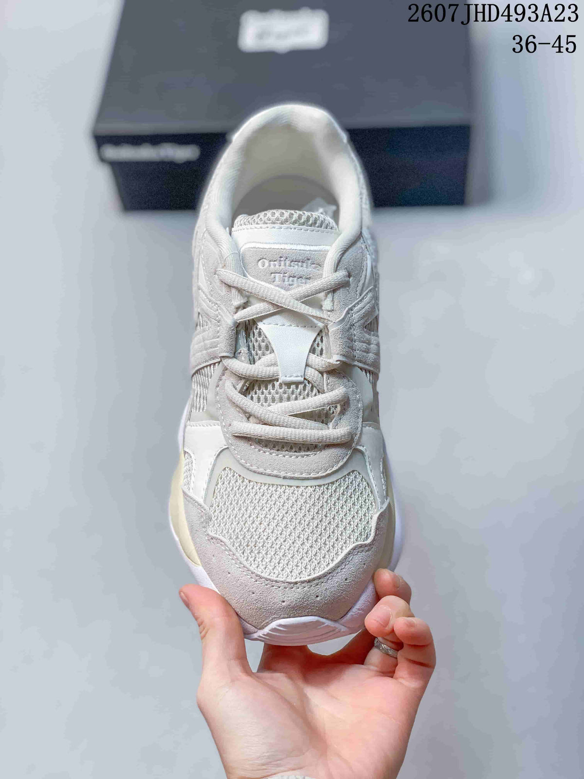 Top view of the sneaker showing the mesh toe box, lace fastening, tongue, and padded collar.