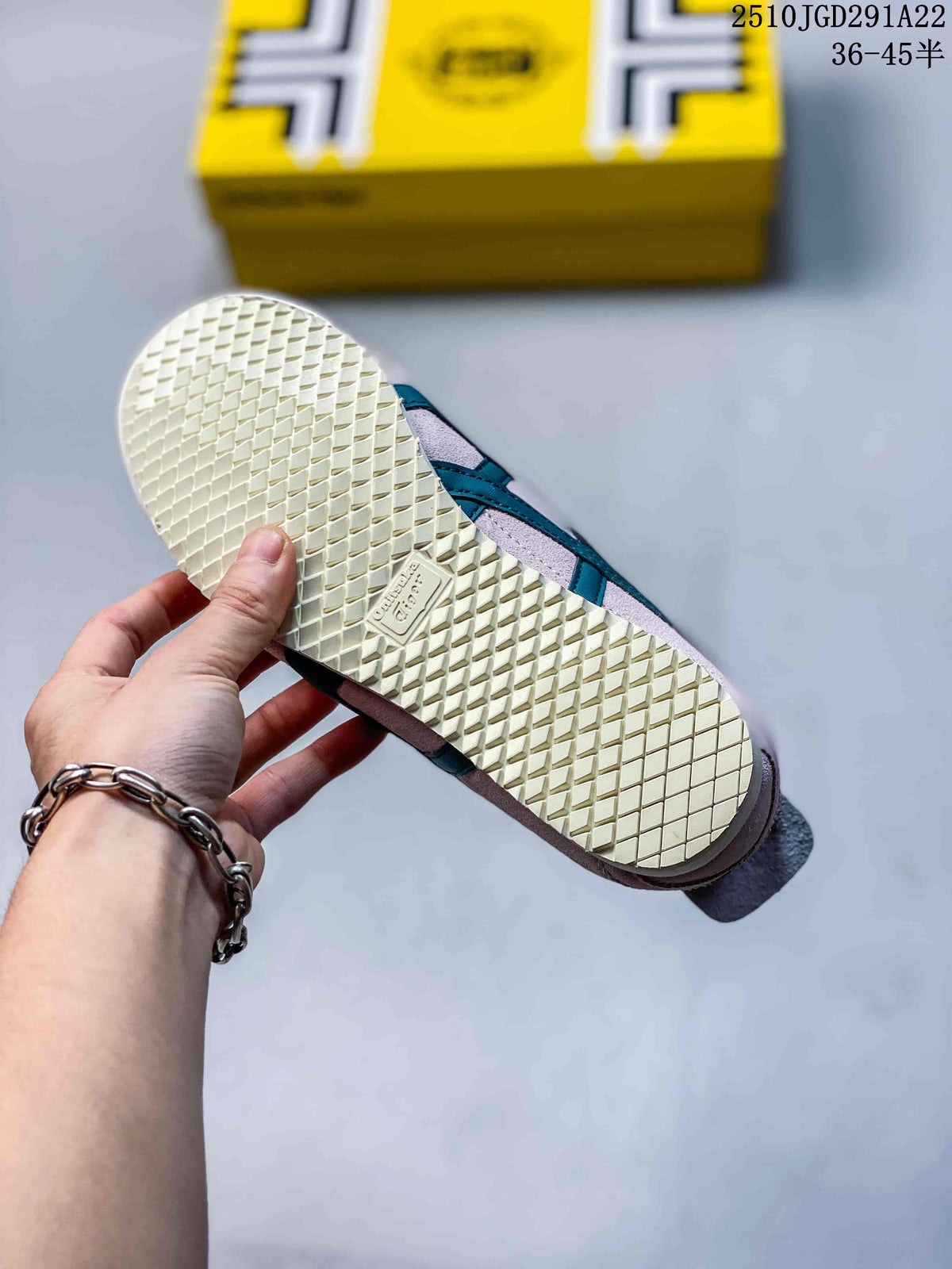 Close-up of the sneaker outsole showing a light cream diamond-patterned tread and branded outsole detail.