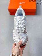 Top view of the white lace-up running shoe showing the tongue, laces, toe box and black Swoosh detail.