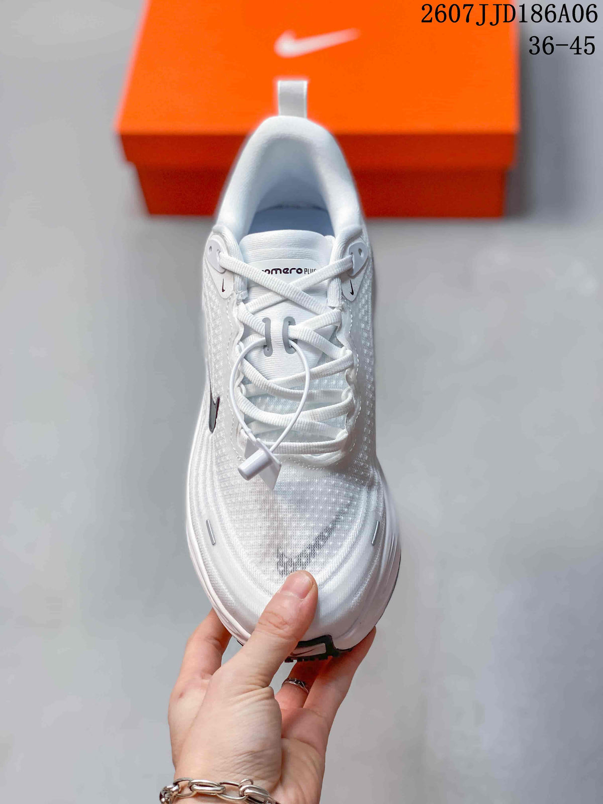 Top view of the white lace-up running shoe showing the tongue, laces, toe box and black Swoosh detail.