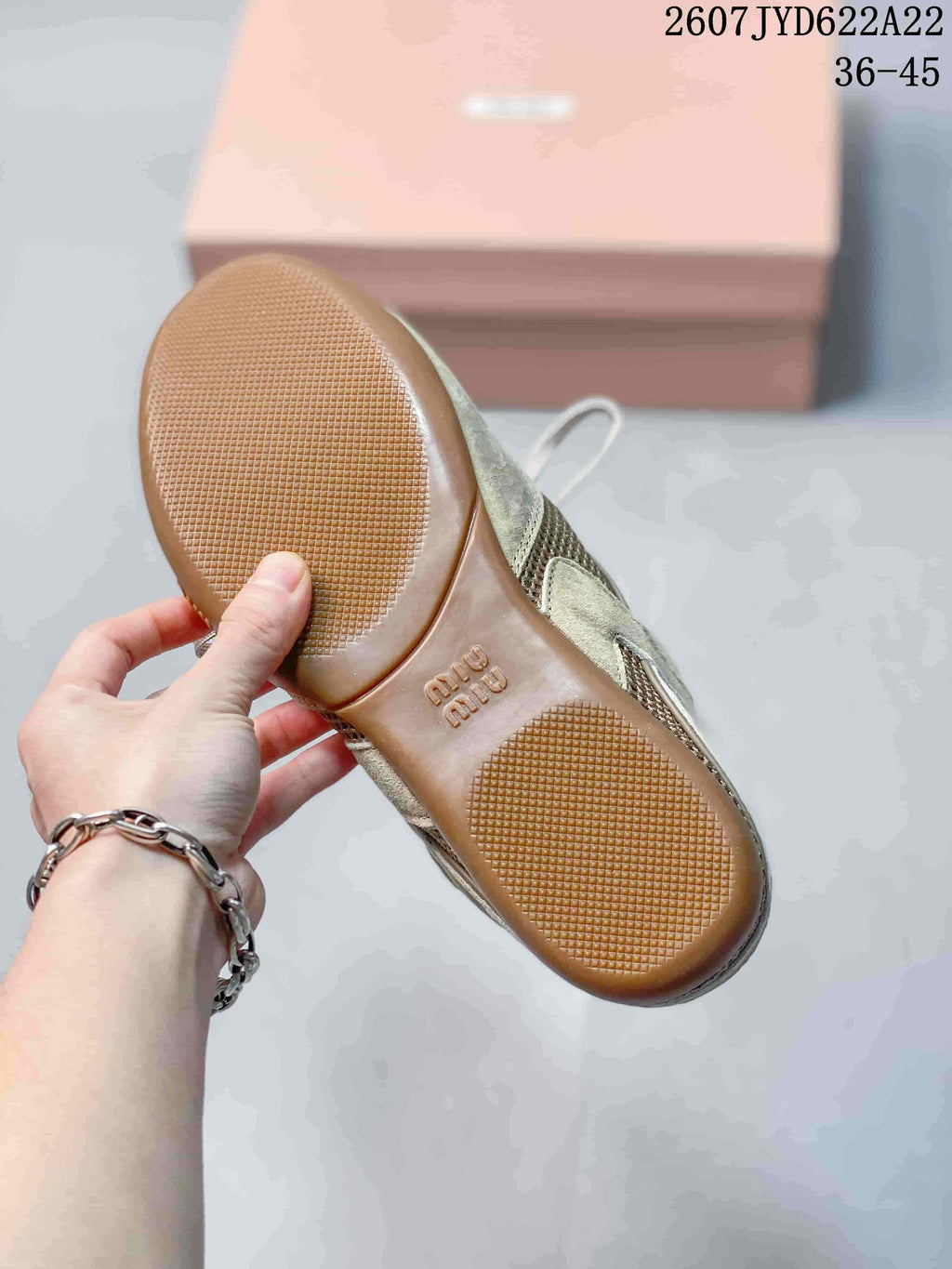 Underside view showing the gum-tone outsole with textured traction areas and embossed Miu Miu branding; image text shows 2607TYD622A22 and 36–45.