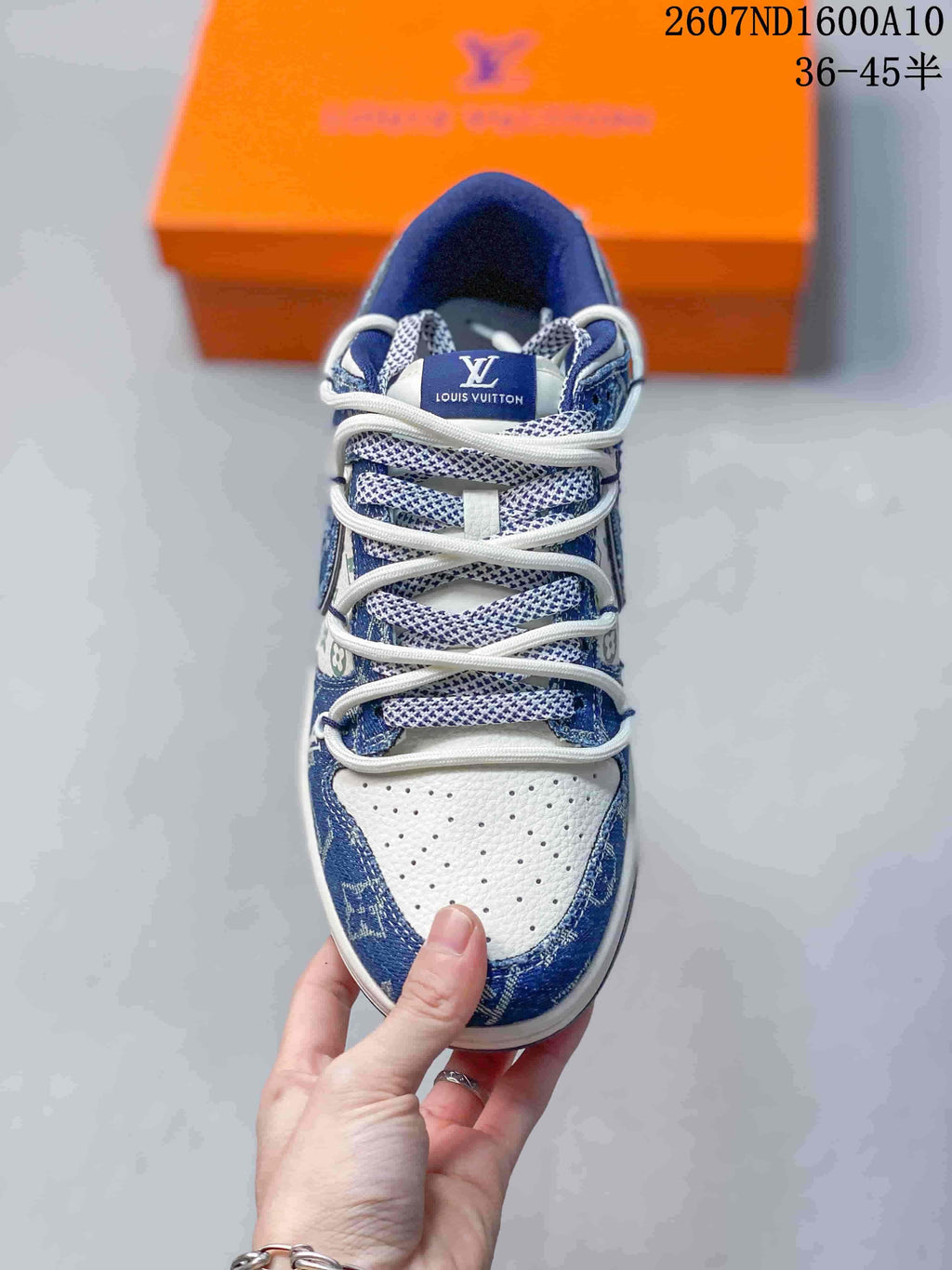 Top view showing the perforated white toe box, patterned blue overlays, and white laces.