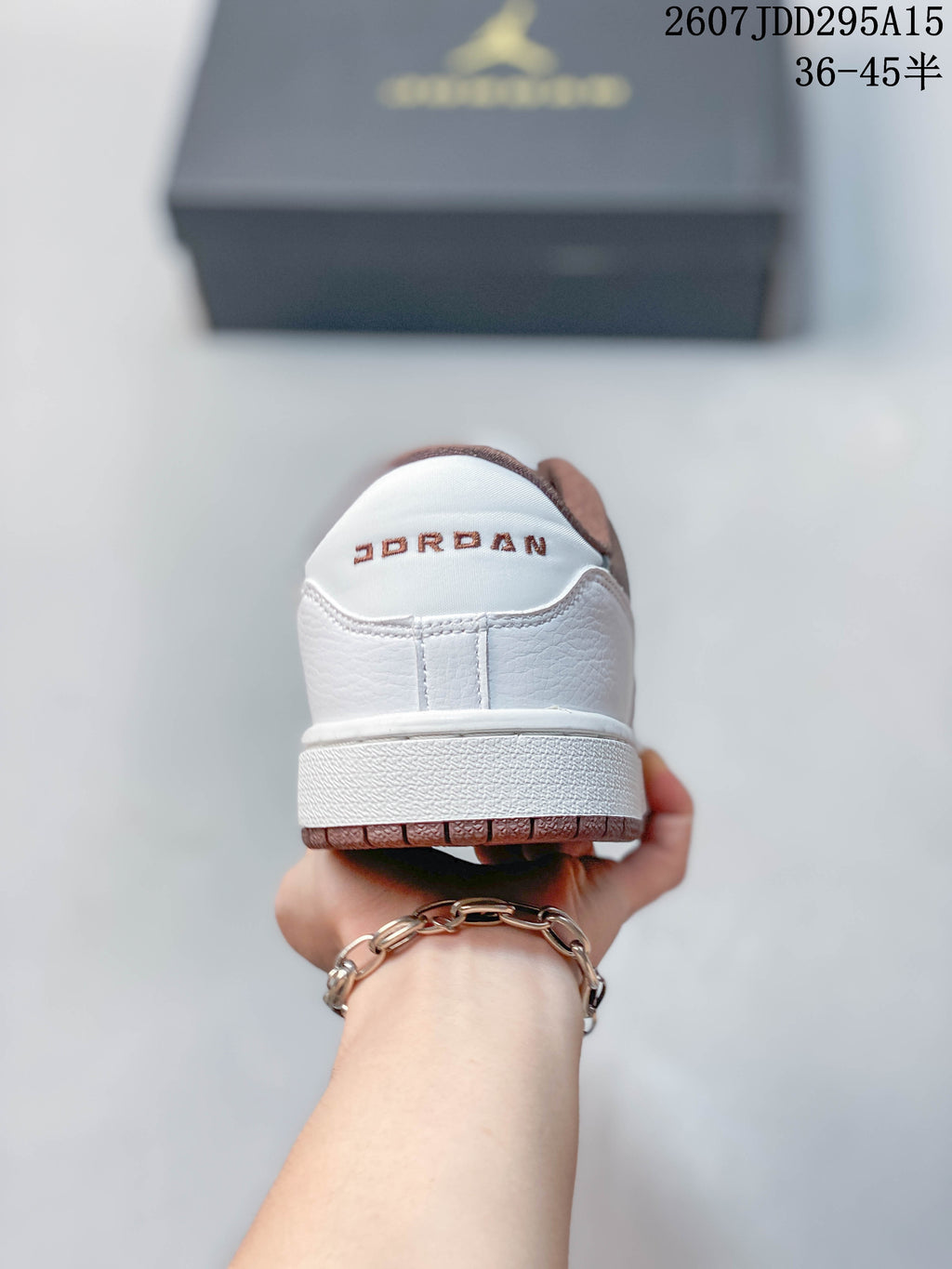 Rear view showing white heel panels and Jordan branding above the outsole.