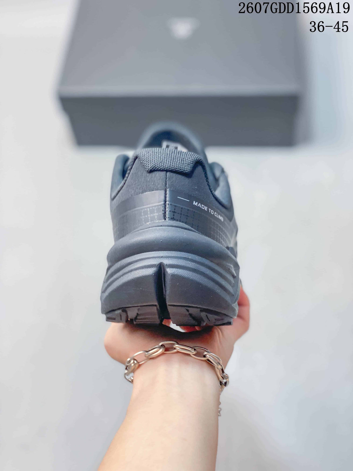Rear view of the dark gray KAILAS shoe showing the padded heel, structured heel counter, and layered outsole.