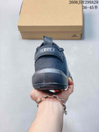 Rear view of a dark gray Terrex sneaker showing the heel pull tab, padded heel area, and rubber heel section.