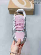 Top view showing the pink tongue and toe panel, silver overlays, and pink laces.