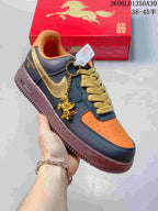 Angled view highlighting the gold-tone side detail, horse-shaped charm, and contrasting navy and orange panels