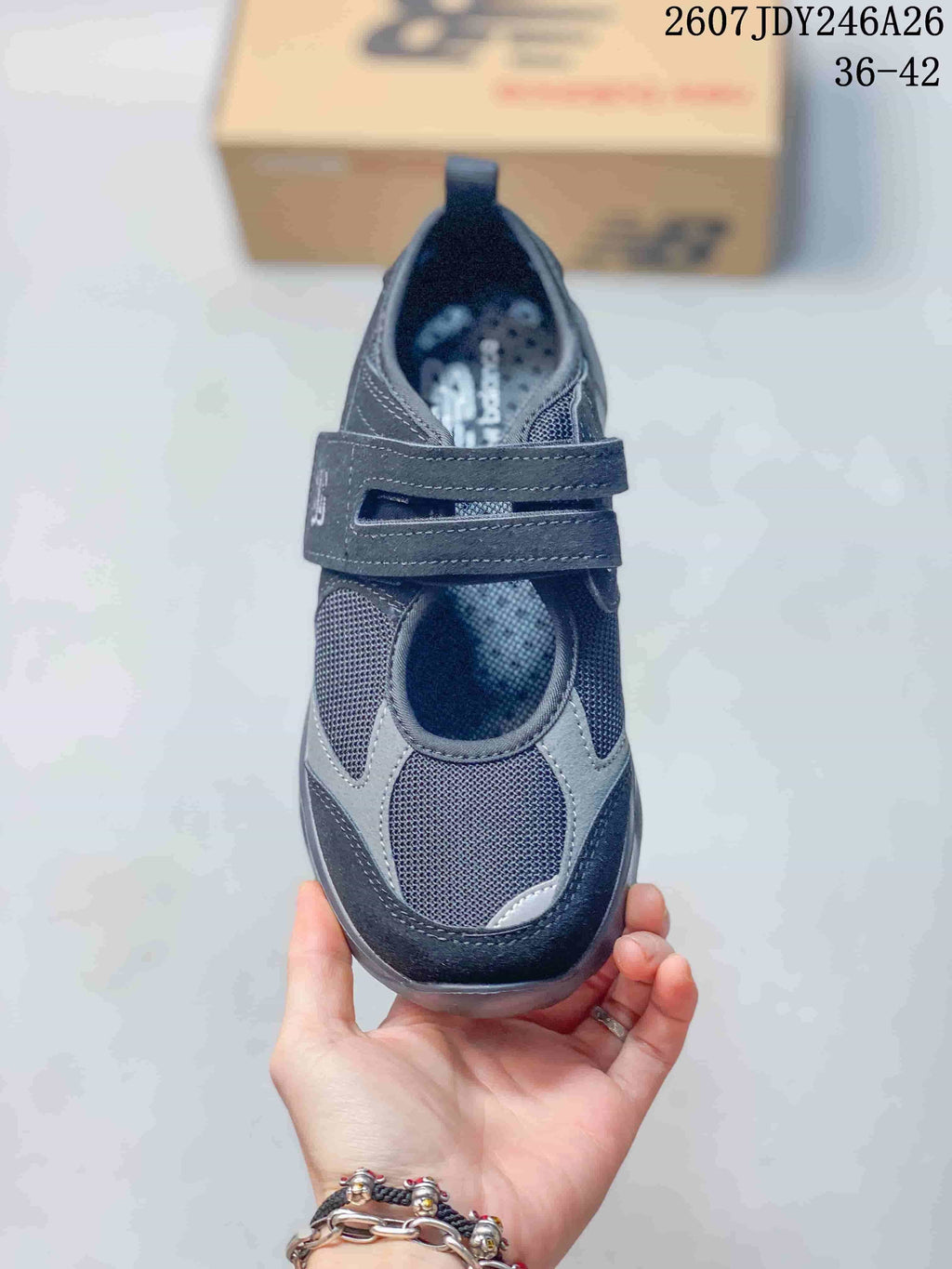 Top view showing the rounded toe, mesh upper, gray overlays, and two forefoot straps.