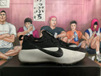 Side view showing a black Nike swoosh and textured silver-gray sole.