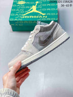 Side profile of the grey and brown low-top sneaker with a speckled Swoosh