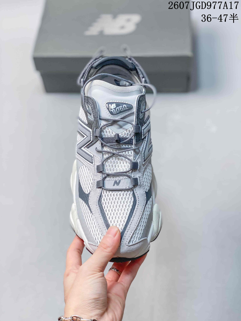 Top view showing the mesh toe box, laces, overlays, and New Balance 9060 tongue label.
