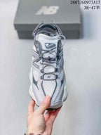 Top view showing the mesh toe box, laces, overlays, and New Balance 9060 tongue label.