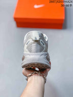Rear view of the sneaker showing the padded heel, layered heel structure, and textured outsole.