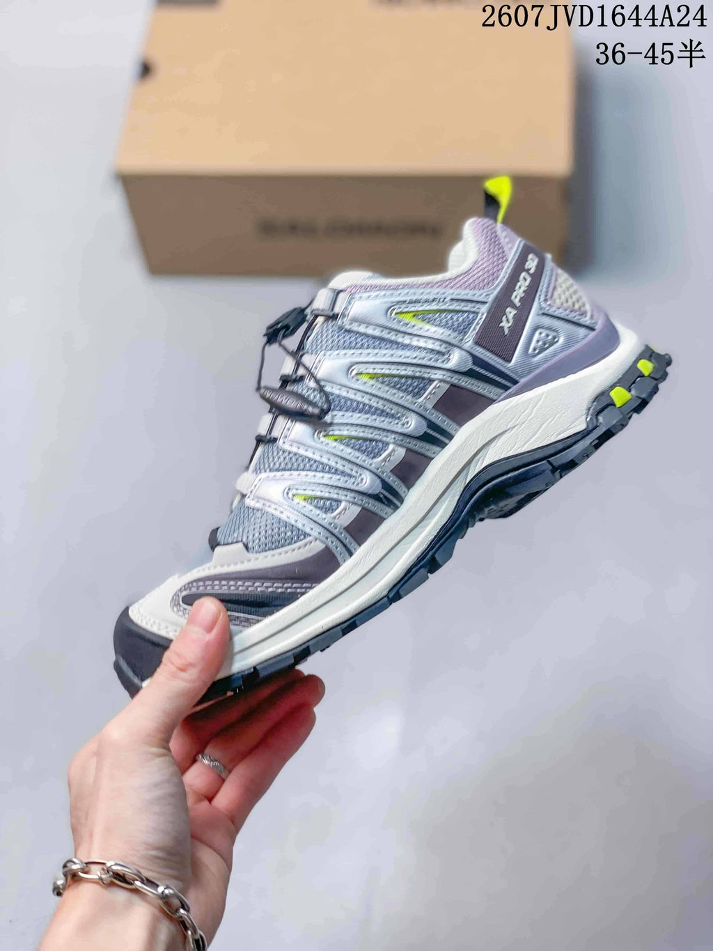 Side profile of a Salomon XA PRO 3D Seasonal sneaker showing layered overlays, toggle lacing and a lugged outsole.