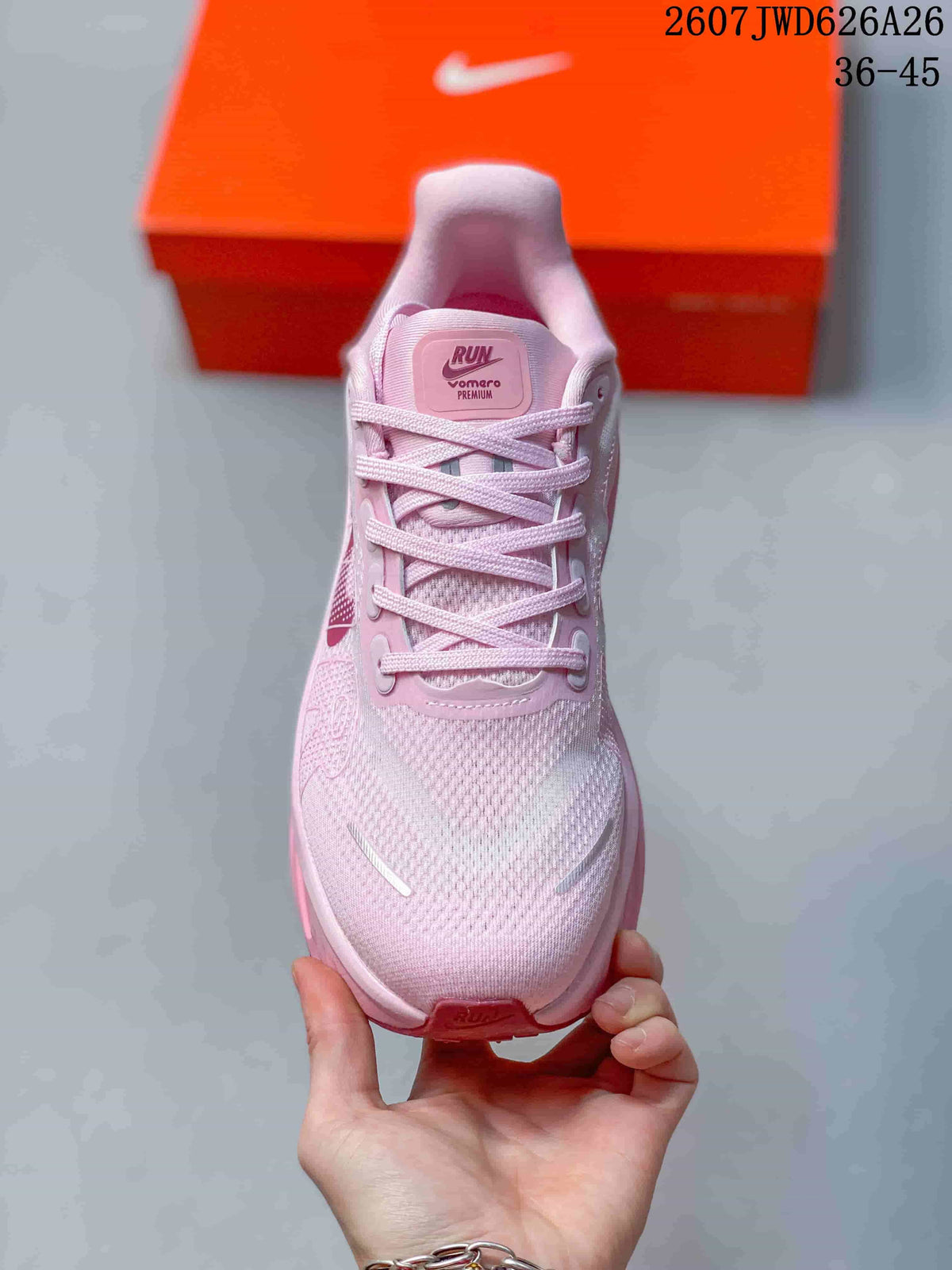 Top view of the pink lace-up sneaker showing the textured toe box, padded tongue, and branding details.