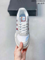 Top view of the sneaker showing white laces, perforated toe panel, blue accents and tongue branding.