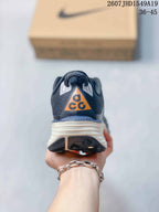 Rear view showing the padded heel, orange ACG-style tongue detail, and layered sole.
