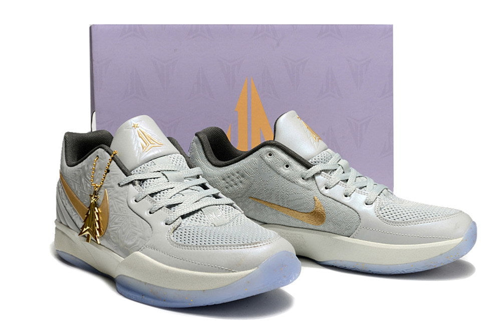 Gray and gold Ja 2 shoes pictured in front of a shoe box.